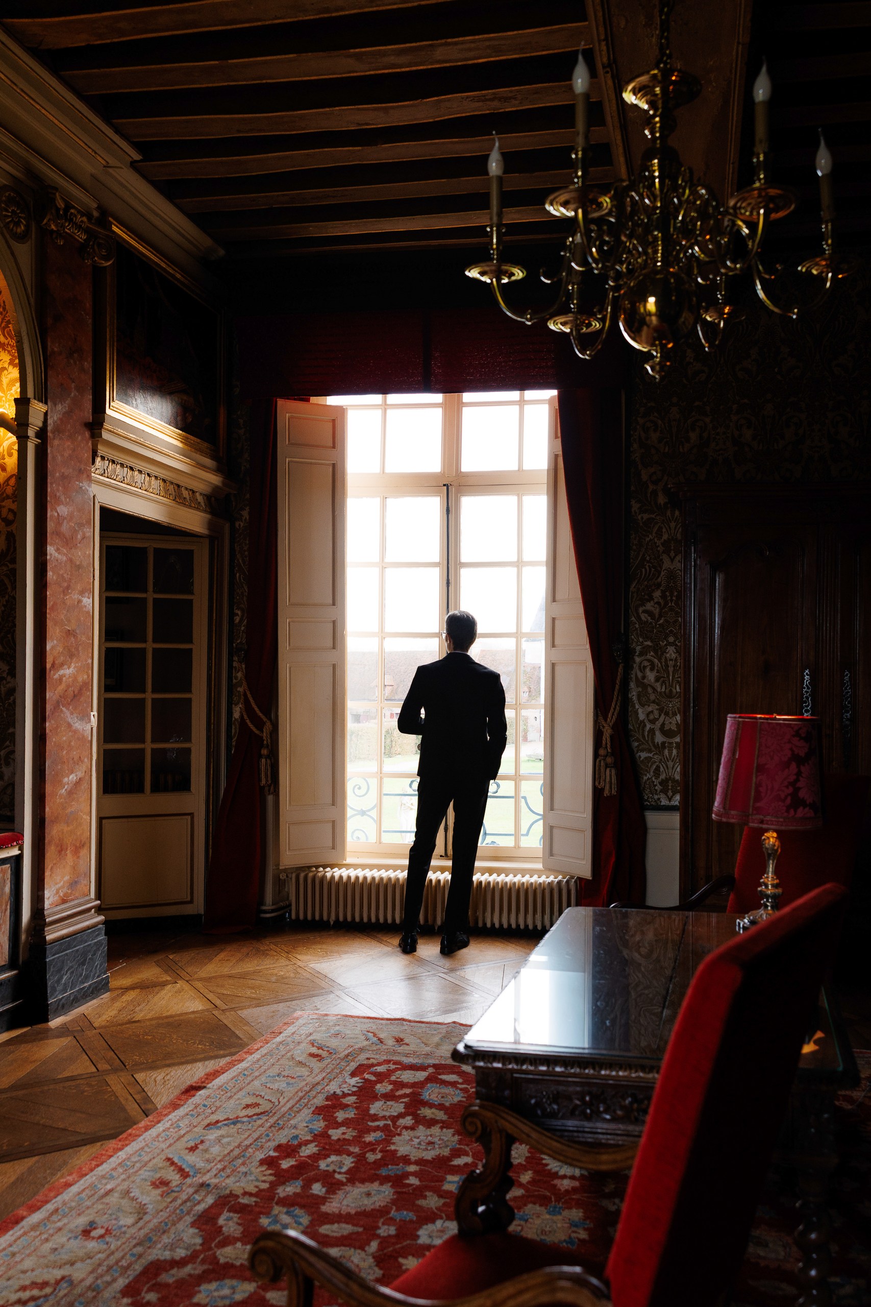 photo of a man in a premium apartment for a wedding photo shoot